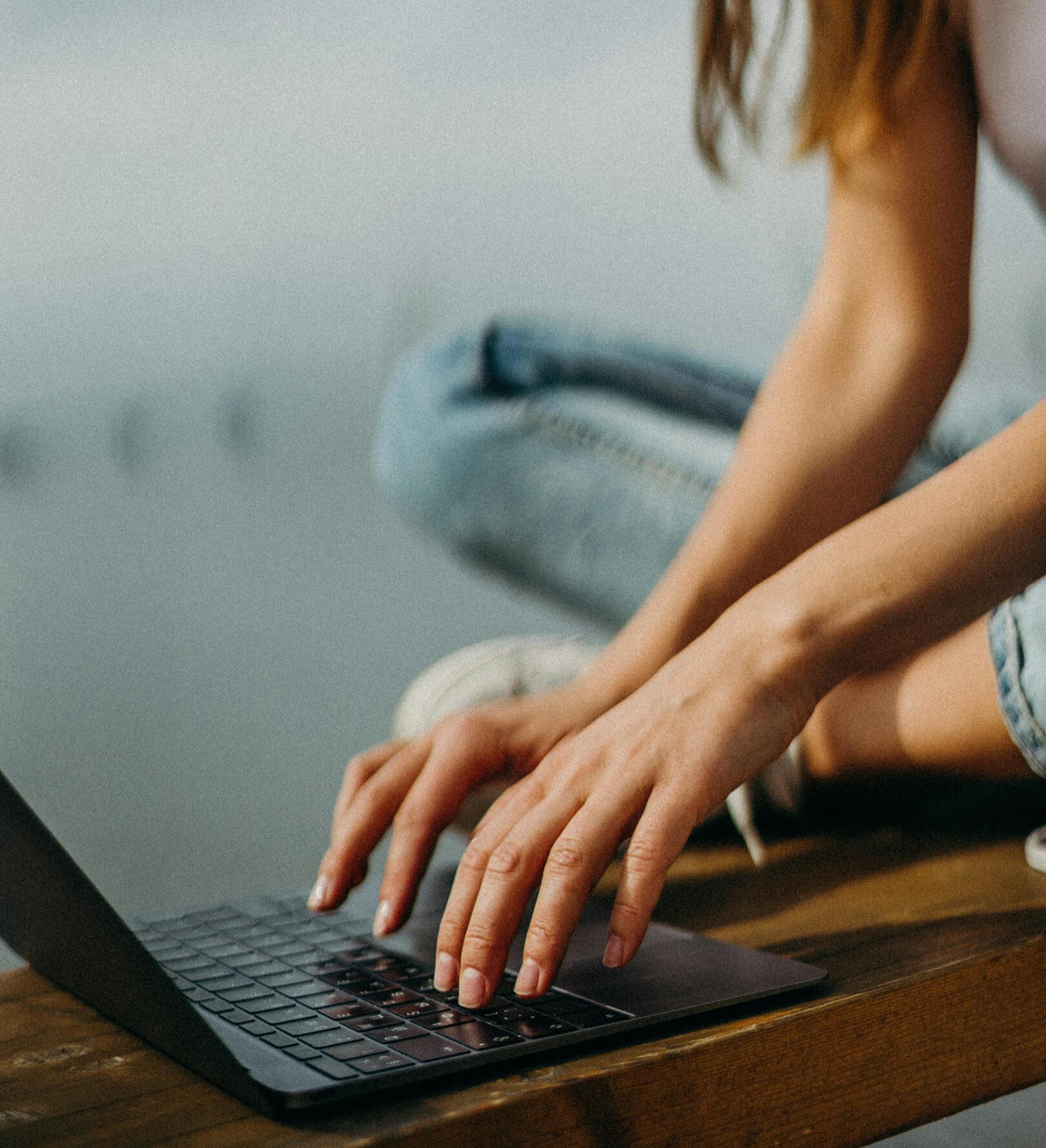 laptop and female writing